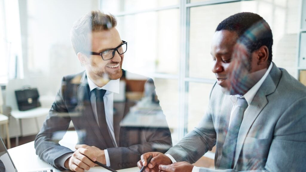 Largest managed IT Managed Services Providers blog featured image of two working professionals