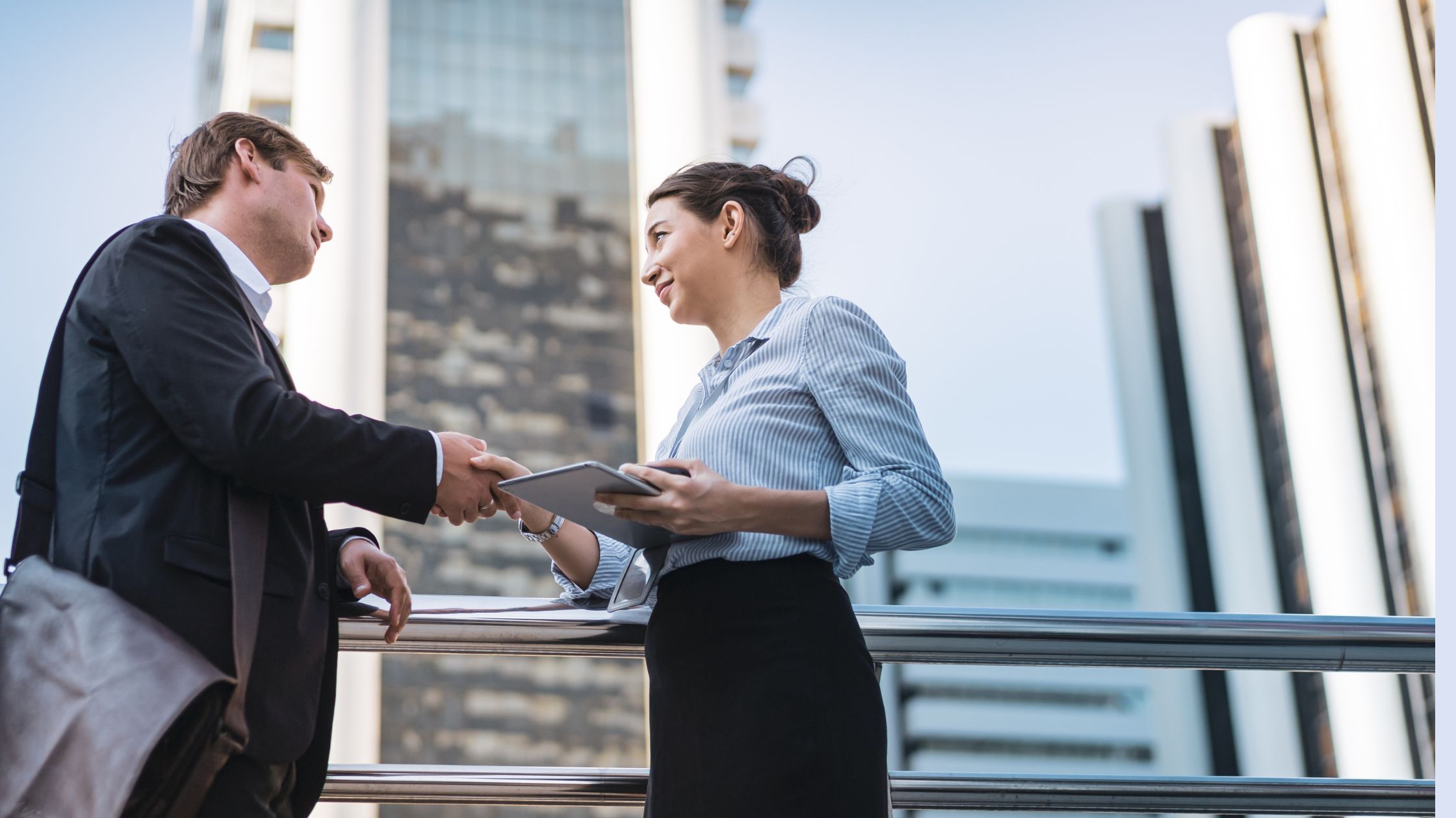 ROle of CFOs in M&A blog featured image of two business leaders shaking hands
